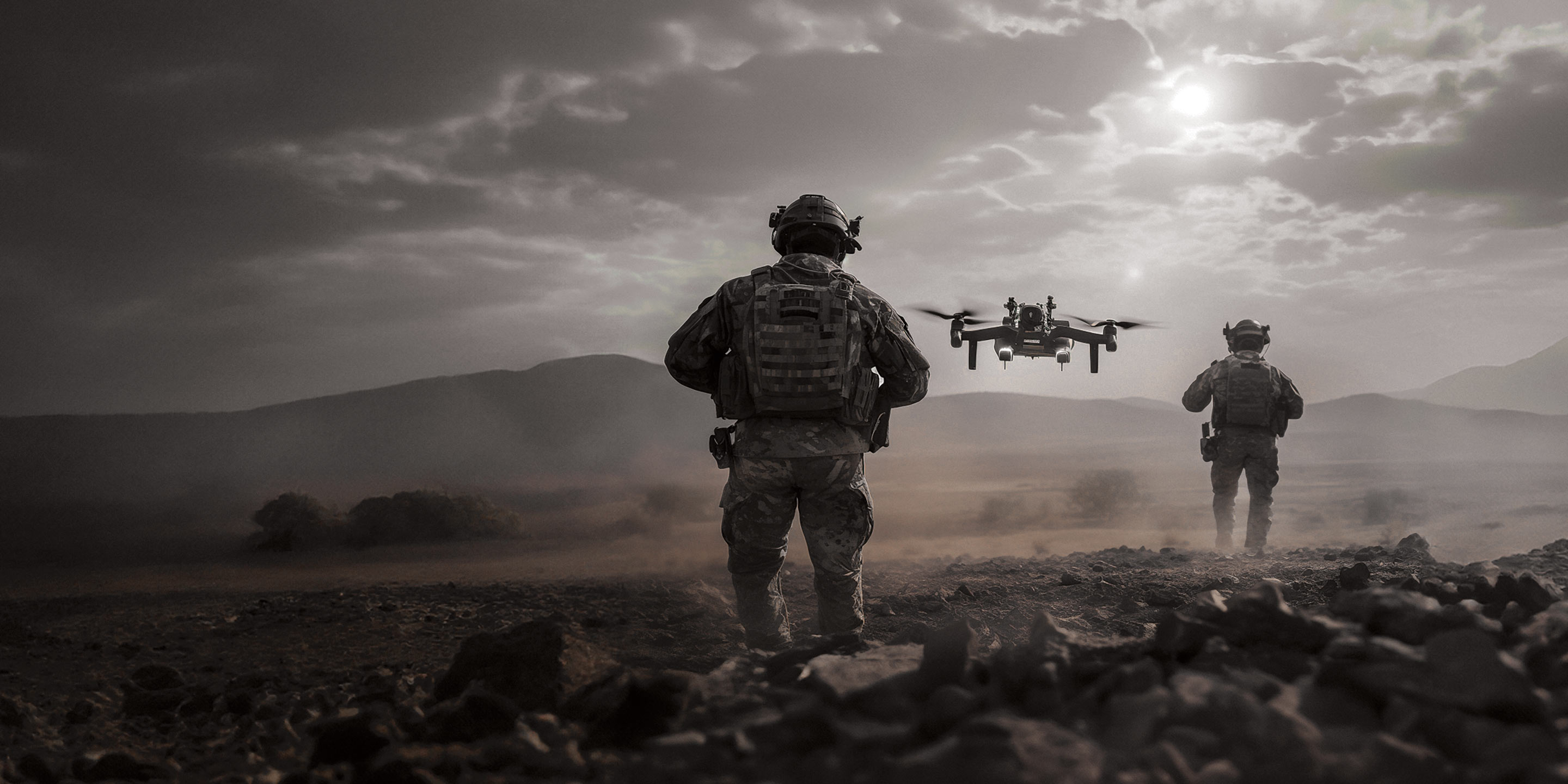 image of soldiers and a flying drone on a field