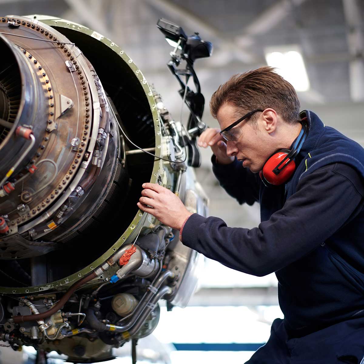 technician working on aircraft engine