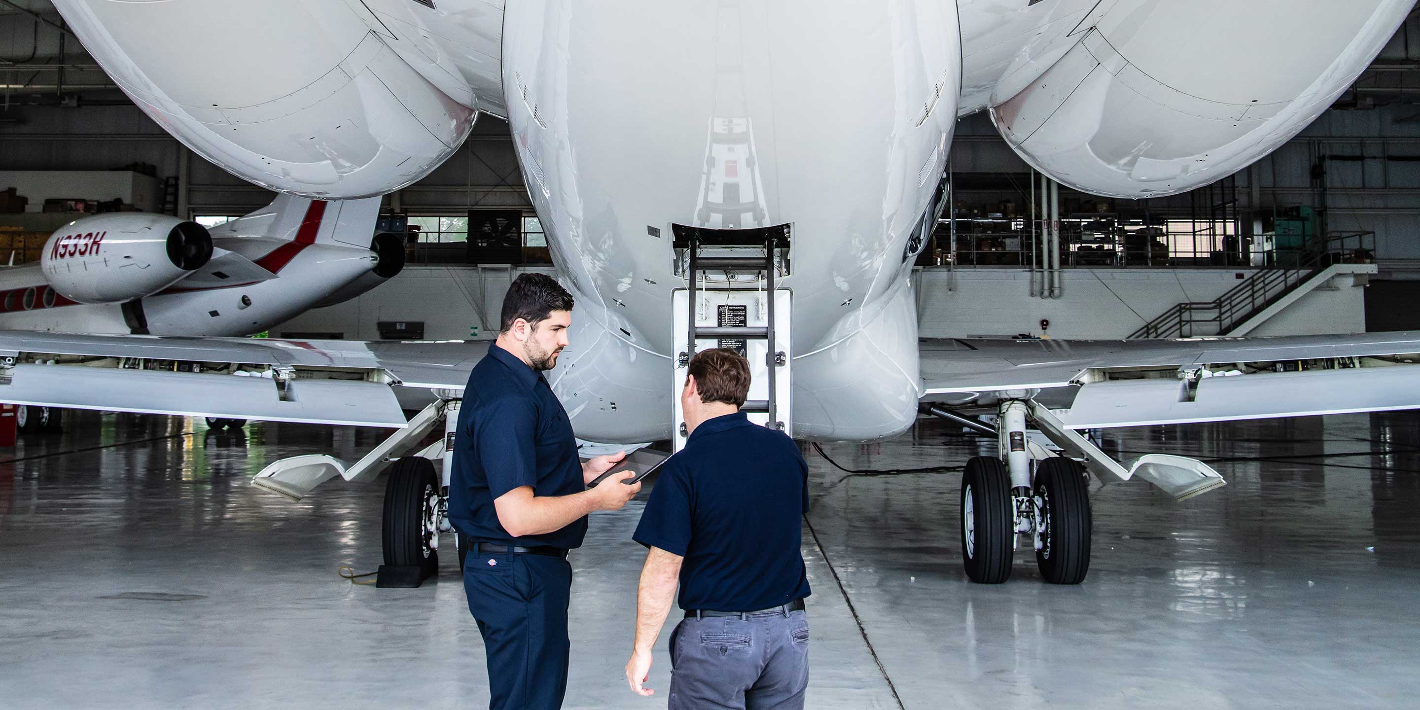 Director of Maintenance Inspecting Rear of G650